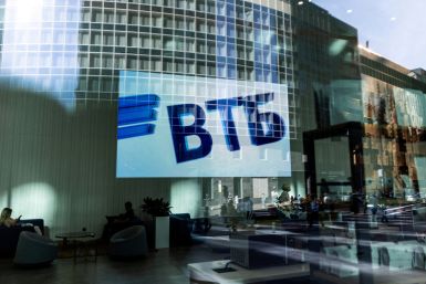 A VTB bank logo is seen on screen through a window in the Moscow International Business Centeron a sunny day in Moscow