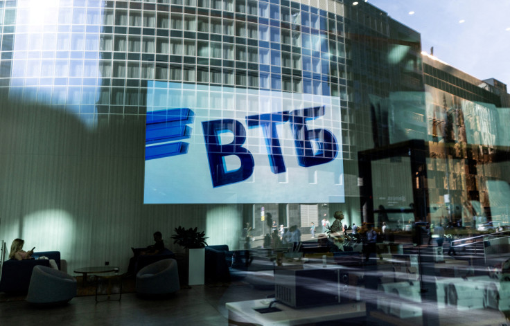 A VTB bank logo is seen on screen through a window in the Moscow International Business Centeron a sunny day in Moscow