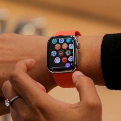 An Apple Store employee shows the Series 5 Apple Watch in New York