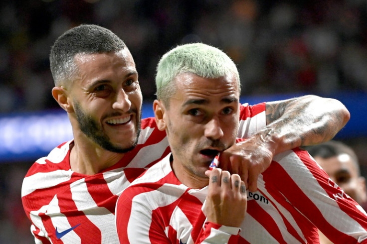 Antoine Griezmann (R) celebrates with Mario Hermoso after scoring Atletico Madrid's winner against Porto in the 11th minute of injury time