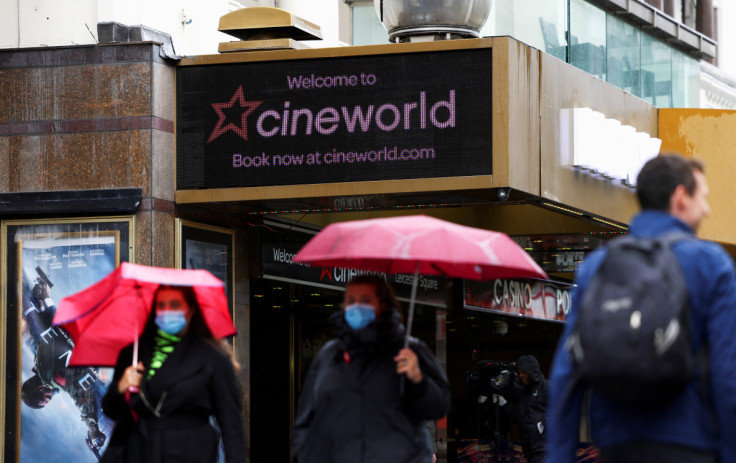 People walk past a Cineworld in Leicester Square in London