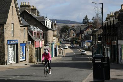 A cyclist is seen riding in Pitlochry