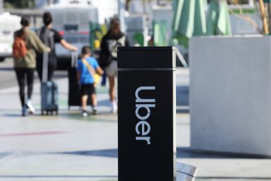 Uber signage is posted at Los Angeles International Airport (LAX) in Los Angeles