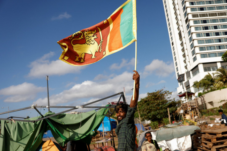 Protesters leave from a seafront tent camp in Colombo