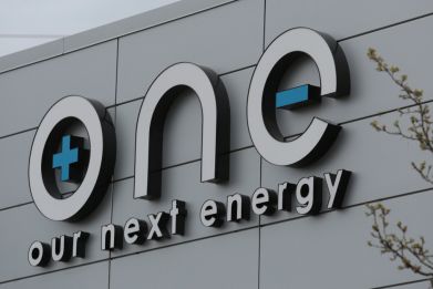 The logo for Our Next Energy is seen outside the company's headquarters in Novi