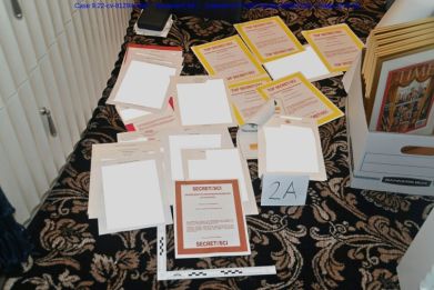This undated file photo released by the US Department of Justice on August 31, 2022 shows a photo of documents allegedly seized at Donald Trump's Mar-a-Lago resort spread over a carpet