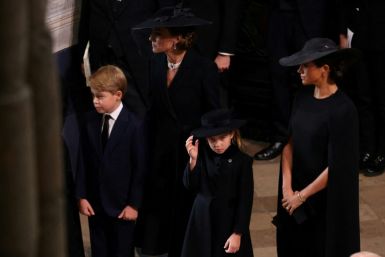 The brothers' wives Catherine (L) and Meghan (R) joined the procession at Westminster Abbey, with William and Kate's two eldest children, Prince George (L) and Princess Charlotte (R)