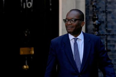 New British Health Chancellor of the Exchequer Kwasi Kwarteng walks outside Number 10 Downing Street in London