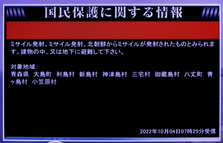 A TV screen displays a warning message called "J-alert" after the Japanese government issued the alert after North Korea fired a ballistic missile, in Tokyo