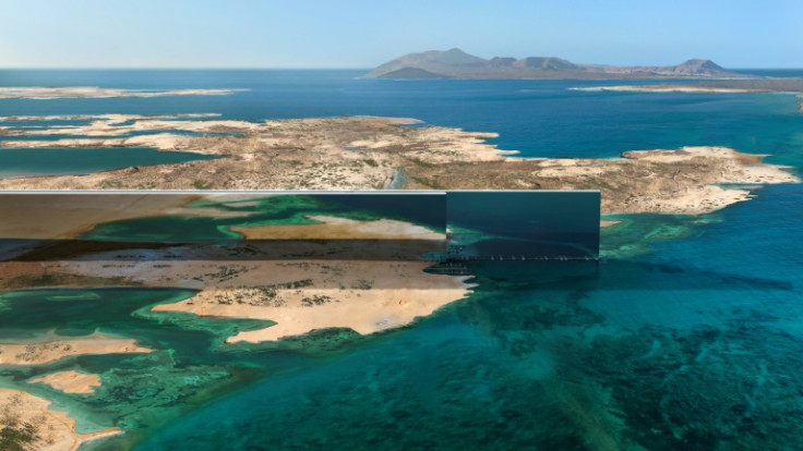 The massive, mirror-encased skyscrapers envisioned by Saudi authorities for the games' host city will stand in stark contrast to the desert terrain of the kingdom's Red Sea coast