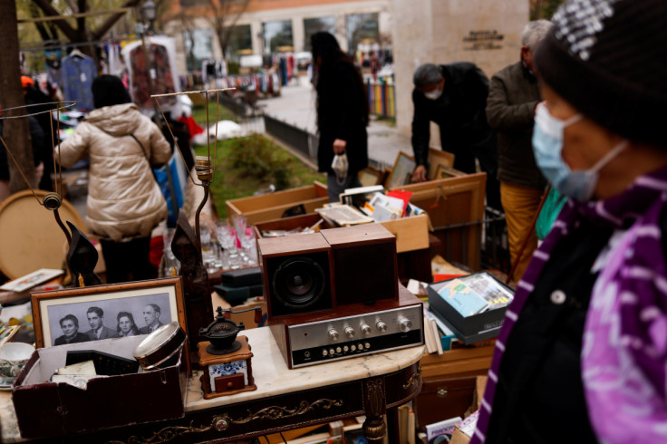 People shop at a street market in Madrid