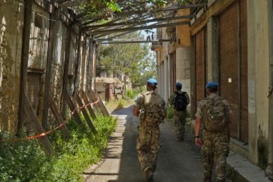 United Nations peacekeepers patrol inside the buffer zone between the internationally recognised Republic of Cyprus and the breakaway Turkish Republic of Northern Cyprus (TRNC) in the divided capital Nicosia on April 26, 2021
