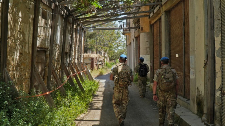 United Nations peacekeepers patrol inside the buffer zone between the internationally recognised Republic of Cyprus and the breakaway Turkish Republic of Northern Cyprus (TRNC) in the divided capital Nicosia on April 26, 2021