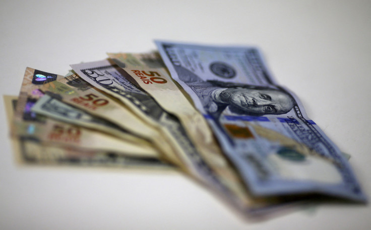 Brazilian Real and U.S. dollar notes are pictured at a currency exchange office in Rio de Janeiro