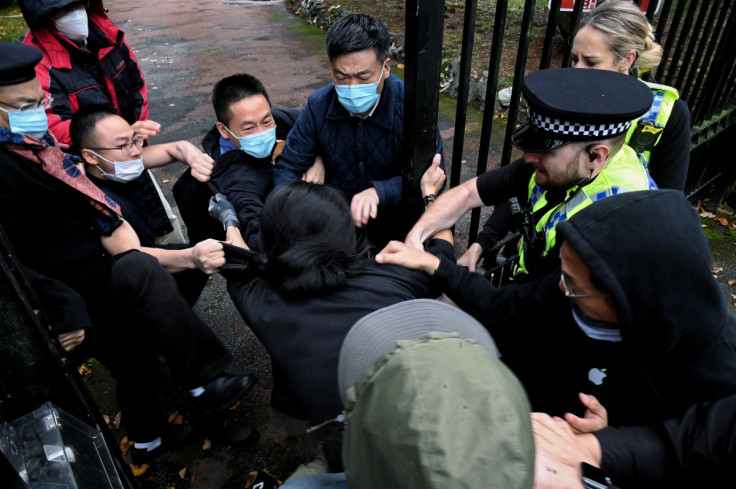 Man is pulled at the gate of the Chinese consulate in Manchester