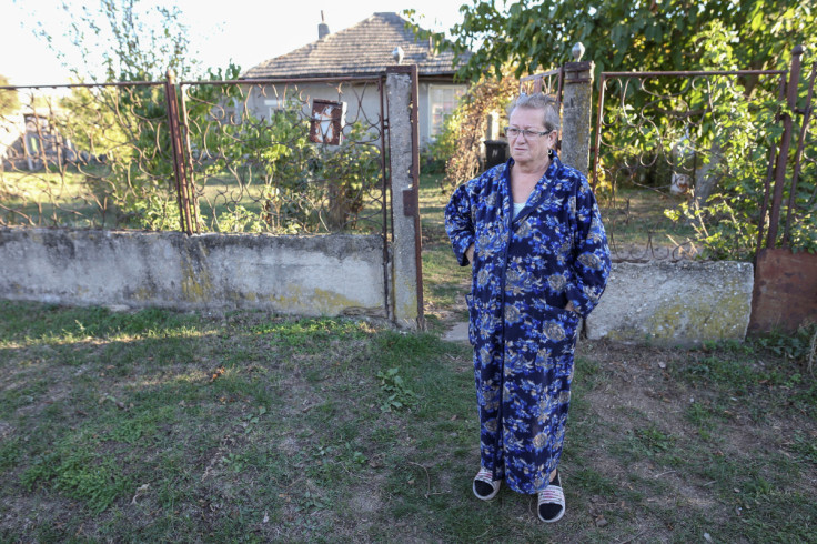 Georgeta Ichim, 67, talks to a Reuters reporter in front of her house in Vasilati