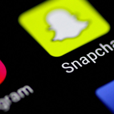 The Snapchat messaging application is seen on a phone screen