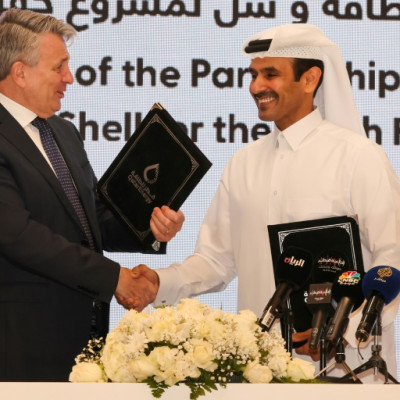 Qatar's Minister of State for Energy Affairs and President and CEO of QatarEnergy Saad Sherida al-Kaabi (R) and Shell’s CEO Ben van Beurden hold a signing ceremony at QatarEnergy headquarters in Doha, on October 23