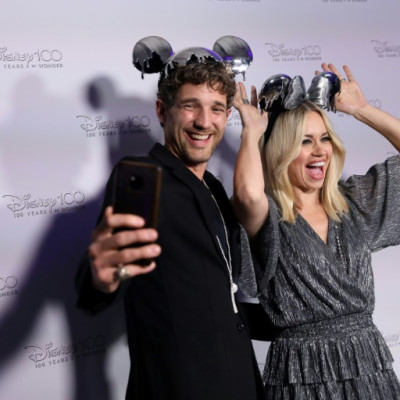 US singer and dancer Kimberly Wyatt and her husband Max Rogers arrive to attend the Disney's D100 Debut event in central London on October 27, 2022.