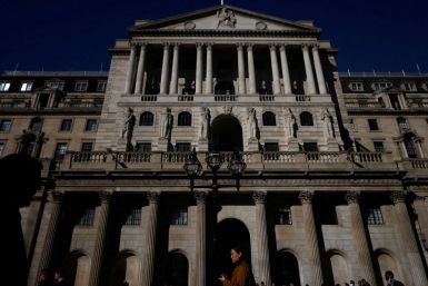 People walk outside the Bank of England in London