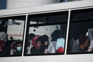 Migrants picked up while attempting to cross the English Channel from France are bused to a processing centre
