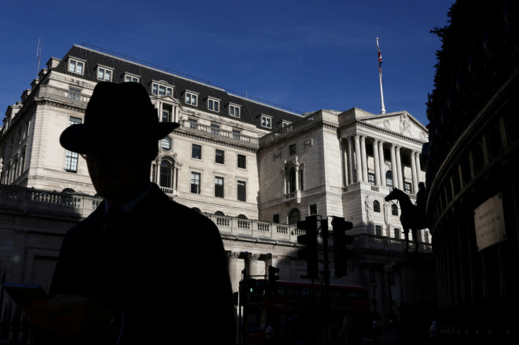 A person walks past the Bank of England in London