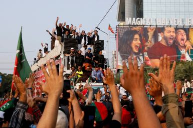 Pakistan's former prime minister Imran Khan leads a freedom march to pressure the government to announce new elections, in Lahore