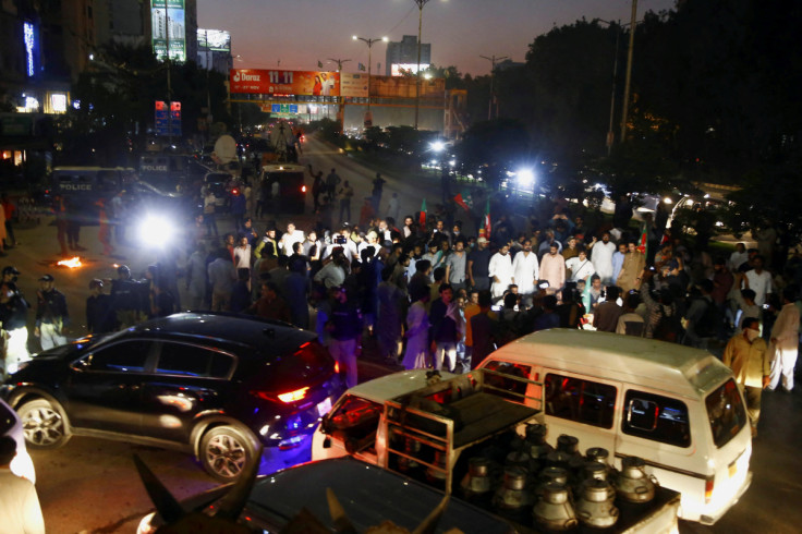 Supporters of Pakistan former Prime Minister Imran Khan, protest following the shooting incident on his long march in Wazirabad, in Karachi,