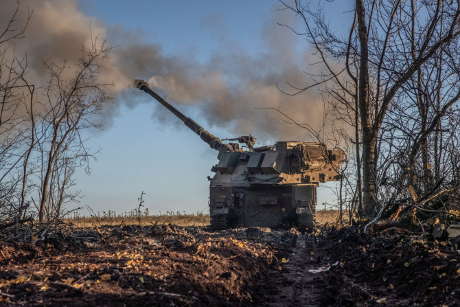 Ukrainian servicemen fire a Polish self-propelled howitzer Krab toward Russian positions in Donetsk region