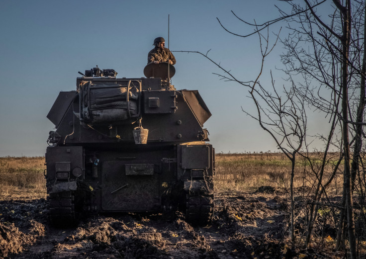 Ukrainian servicemen prepare a Polish self-propelled howitzer Krab to fire toward Russian positions on a frontline in Donetsk region