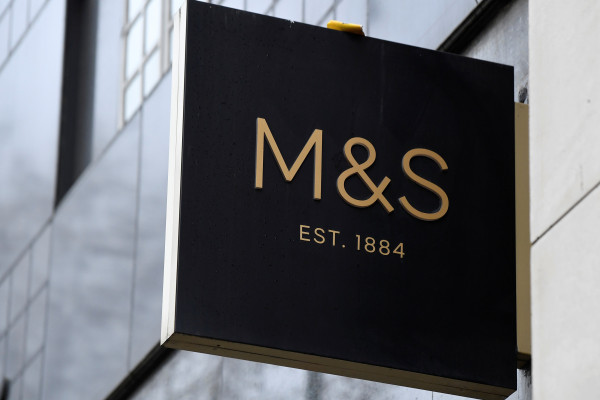 A sign for Marks and Spencer (M&S) hangs outside one of their UK stores in London