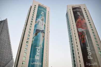 England captain Harry Kane (left) and Dutch skipper Virgil van Dijk feature on buildings in Doha ahead of the World Cup