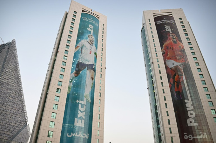 England captain Harry Kane (left) and Dutch skipper Virgil van Dijk feature on buildings in Doha ahead of the World Cup