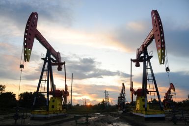 Pumpjacks are seen during sunset at the Daqing oil field in Heilongjiang