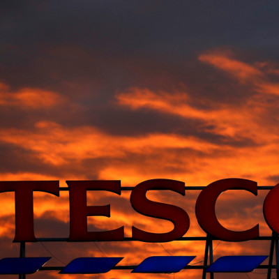 A company logo is pictured outside a Tesco  supermarket in Altrincham northern England.
