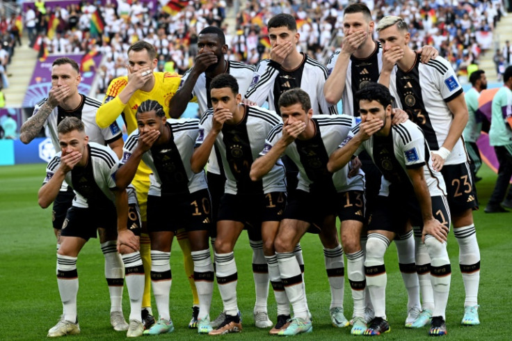 Germany players gesture as they pose for a team photo before their opening World Cup match