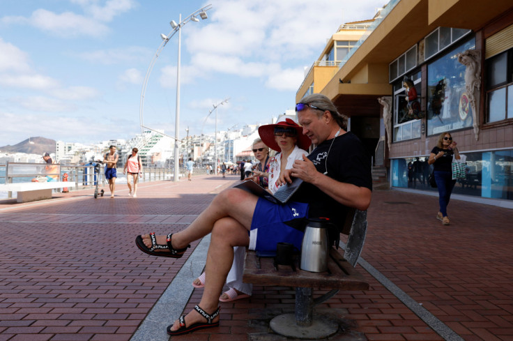 50-year-old Victor Varlamov works remotely from Las Canteras Beach Avenue in Las Palmas de Gran Canaria