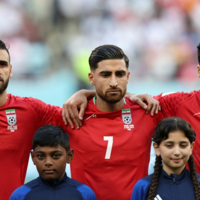 Iran's players, including captain Alireza Jahanbakhsh (C) chose not to sing the national anthem before their opening match