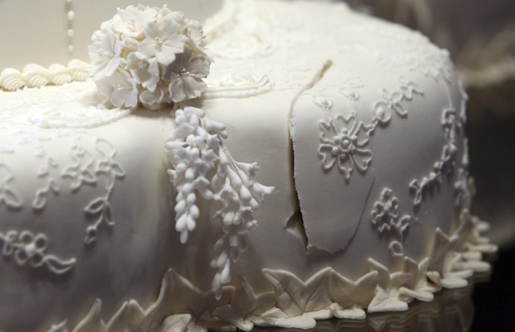 The first cut made in the royal wedding cake by Britain's Prince William and Catherine, Duchess of Cambridge is seen at Buckingham Palace in London