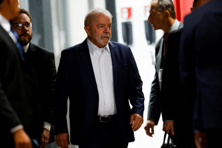 Brazilian President-elect Luiz Inacio Lula da Silva walks after attending a meeting at the transition government building in Brasilia