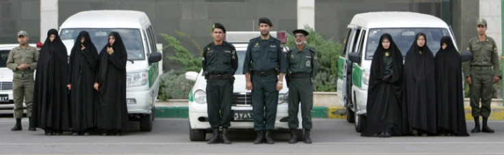 Morality police men and women prepare for patrol in 2007, when they began to crack down and arrest women
