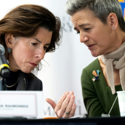 US Secretary of Commerce Gina Raimondo (L) speaks with European Commission Executive Vice President Margrethe Vestager (R) as they participate in a US-EU dialogue on December 5, 2022