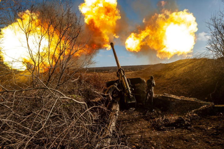 Ukrainian servicemen fire a 130 mm towed field gun M-46 on a front line near Soledar