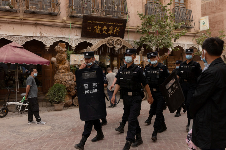 In China's new Xinjiang: patriotic tourism, police and propaganda