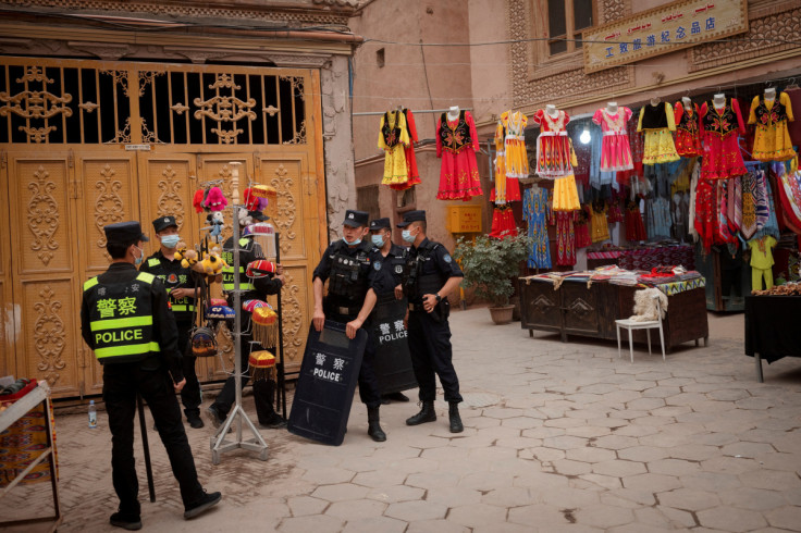 The Wider Image: In China's new Xinjiang: patriotic tourism, police and propaganda