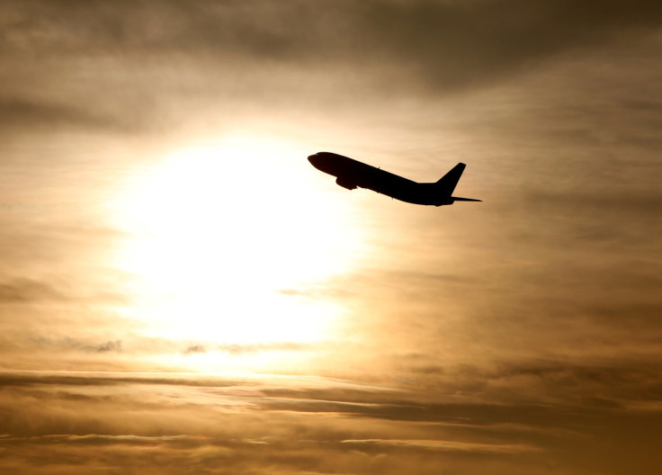 A plane is seen during sunrise at the international airport in Munich