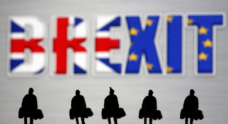 Small toy figures are seen in front of a Brexit logo in this illustration picture