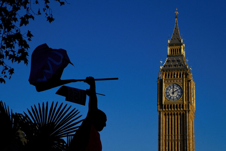 Royal Mail workers protest as members strike over pay and conditions, in London