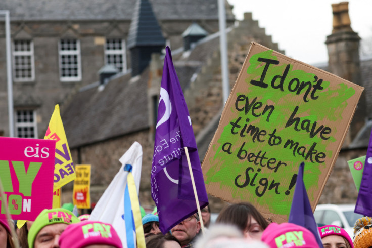 Members of the EIS and their supporters attend a rally outside the Scottish Parliament in Edinburgh