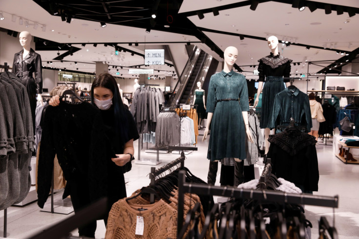 A woman looks at cloth at Polish fashion retailer LPP brand Reserved shop in Warsaw